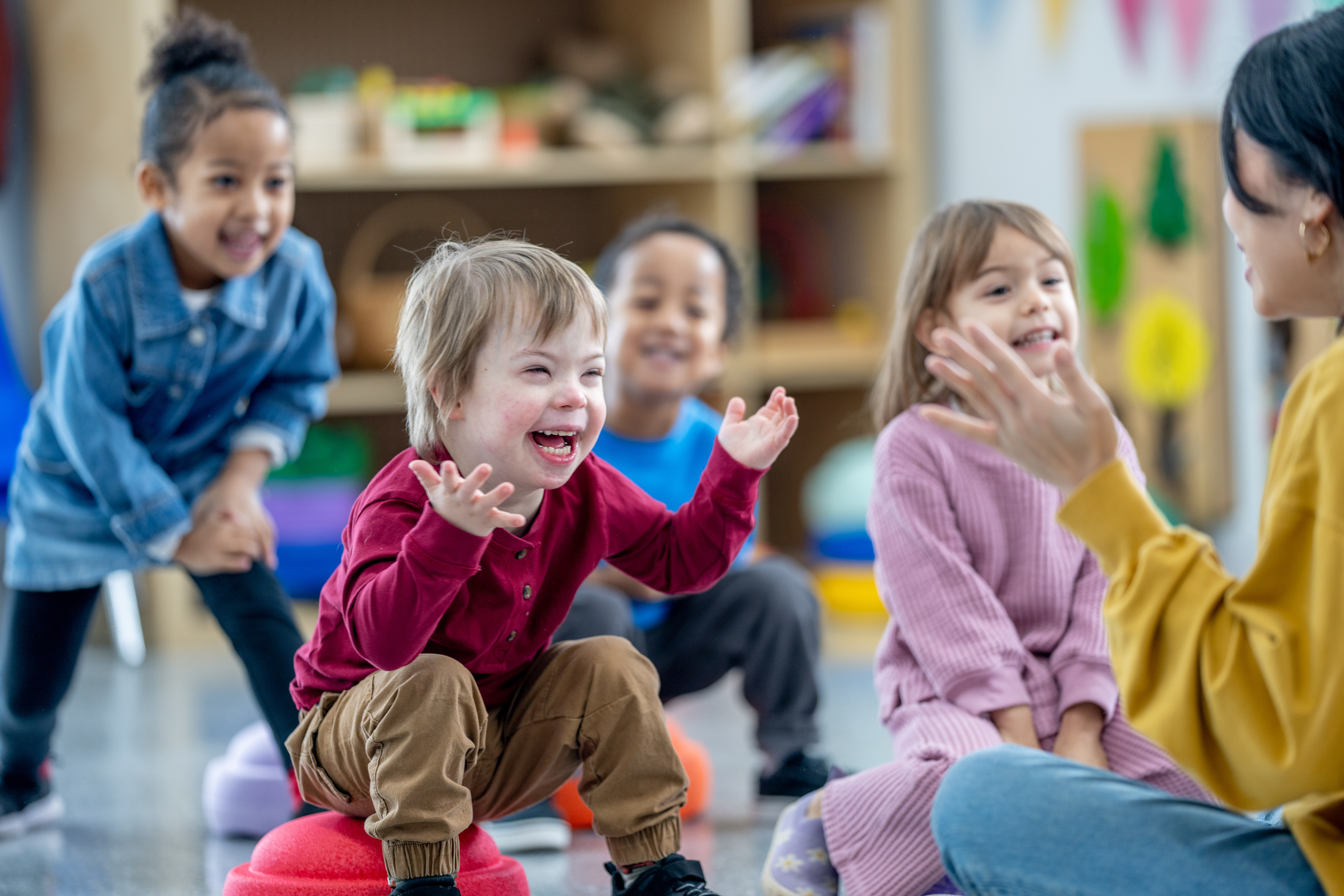 Children laughing and playing together in a community setting
